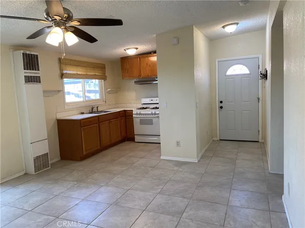 a view of a kitchen with a sink and cabinet