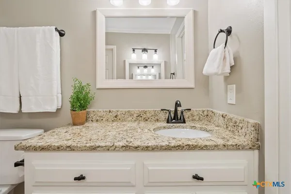 a bathroom with a shower curtain and a toilet