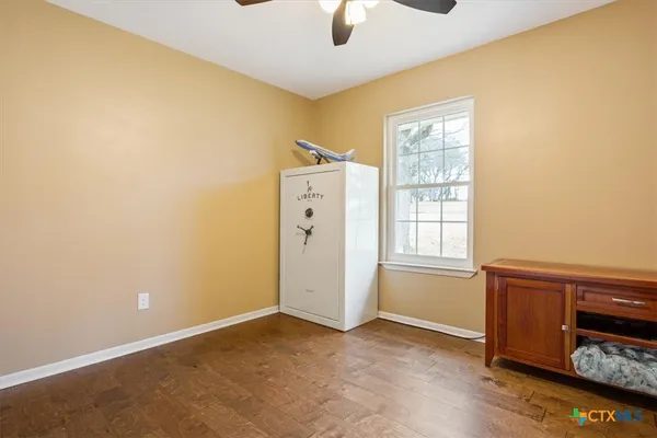 a view of a livingroom with furniture and a flat screen tv