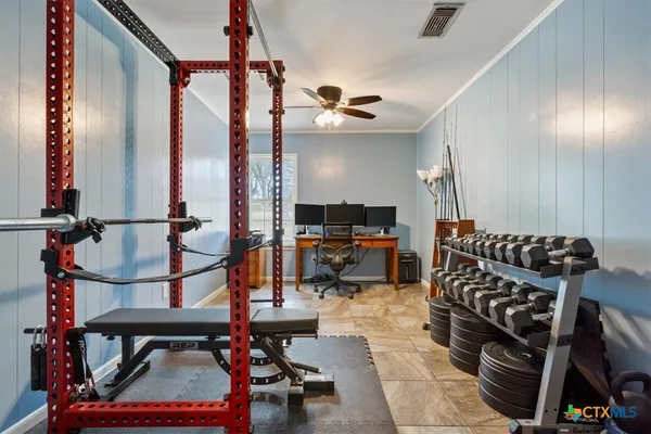 a bathroom with a granite countertop toilet sink and mirror