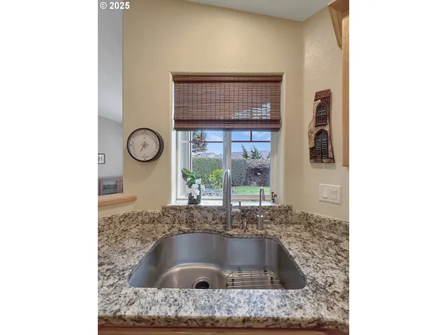 a kitchen with sink and window