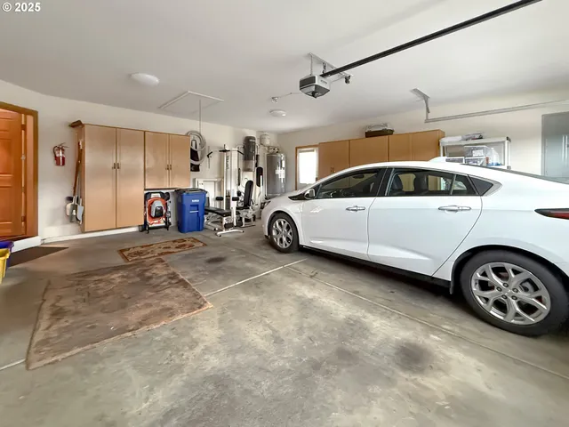 a view of parking garage with cars
