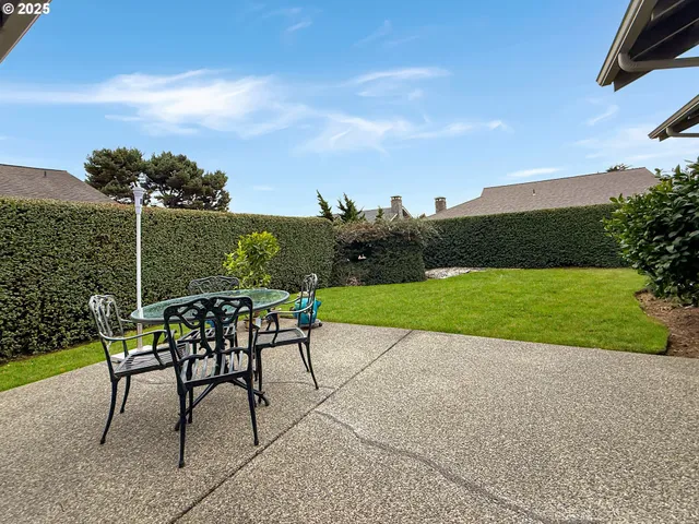 a view of a garden with furniture