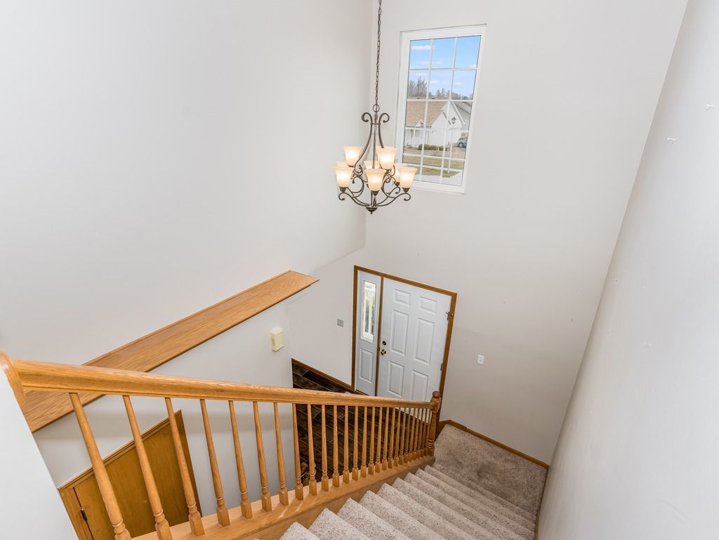 265 Rollin Road Somonauk, IL 60552 - Photo 27 of 33 a view of a hallway with wooden floor and staircase