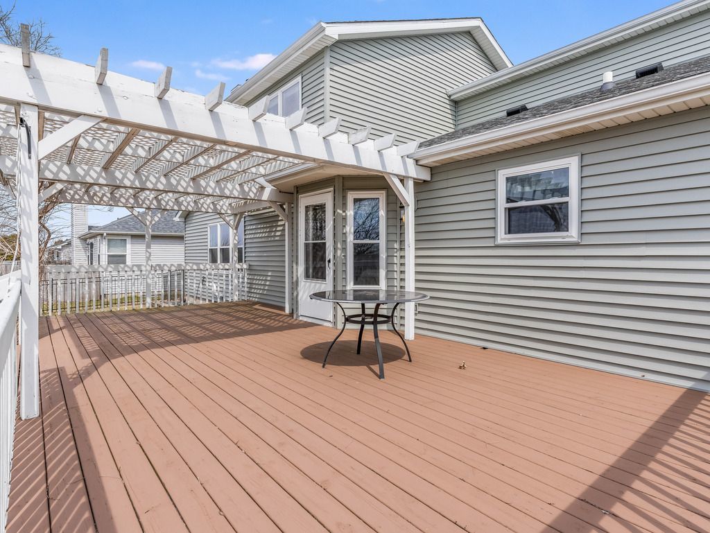 265 Rollin Road Somonauk, IL 60552 - Photo 4 of 33 a patio with table and chairs and potted plants