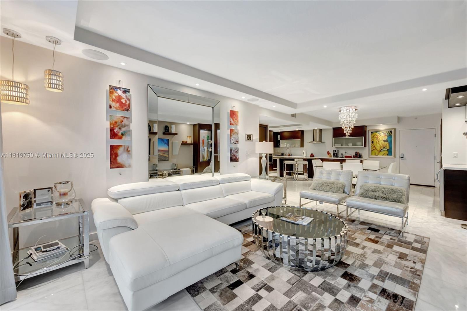 2301 Collins Avenue, Unit 307 Miami Beach, FL 33139 - Photo 4 of 17 a living room with furniture and a dining table with kitchen view