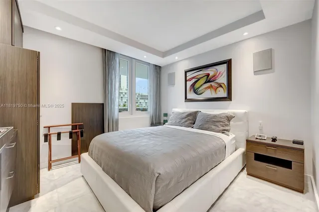 a bedroom with a bed and a desk