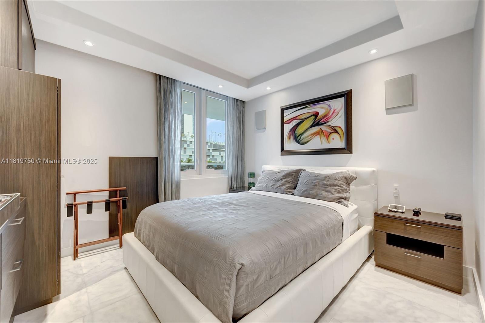 2301 Collins Avenue, Unit 307 Miami Beach, FL 33139 - Photo 5 of 17 a bedroom with a bed and a desk