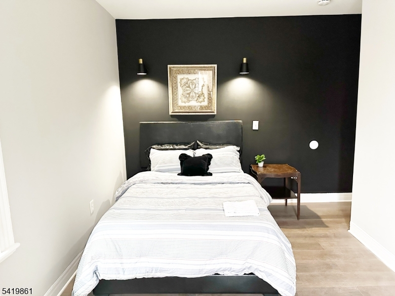 34 Duryea Street Newark, NJ 07103 - Photo 12 of 15 a bed room with a bed and a night stand