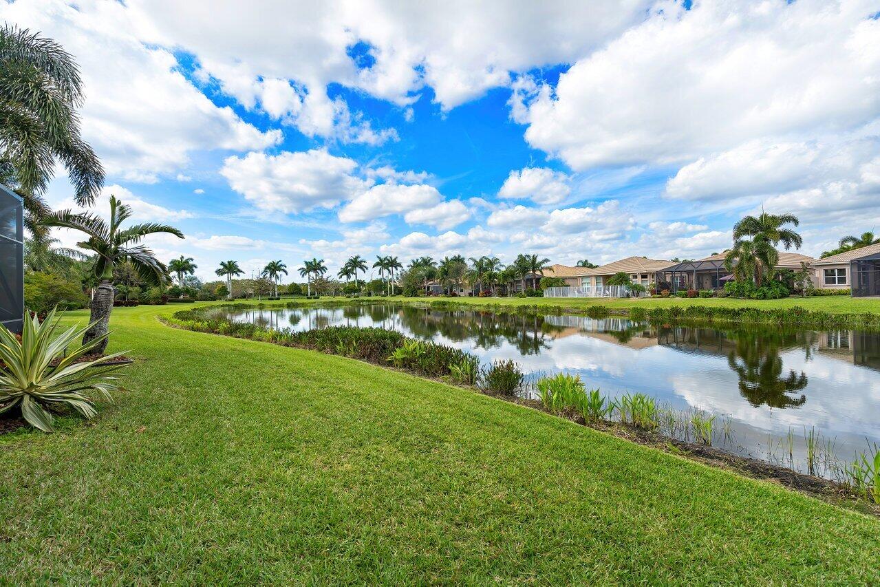 9047 Ribbons Ridge Point Boynton Beach, FL 33473 - Photo 20 of 37 a view of a lake with a city