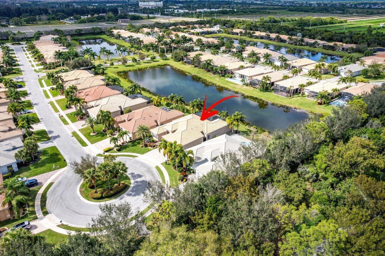 9047 Ribbons Ridge Point Boynton Beach, FL 33473 - Photo 24 of 37 an aerial view of residential houses with outdoor space and swimming pool