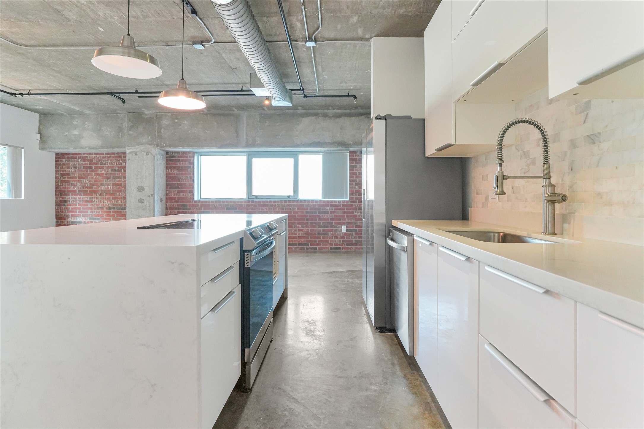 2000 Bagby Street, Unit 2401 Houston, TX 77002 - Photo 26 of 38 a kitchen with stainless steel appliances a sink and cabinets