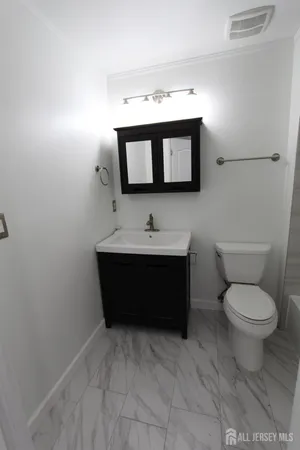 a bathroom with a toilet and shower