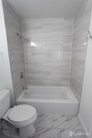 a view of a room with wooden floor and staircase