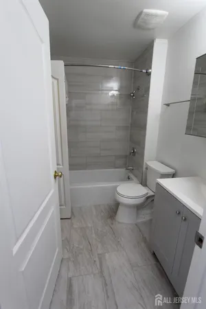 a view of backyard with wooden fence