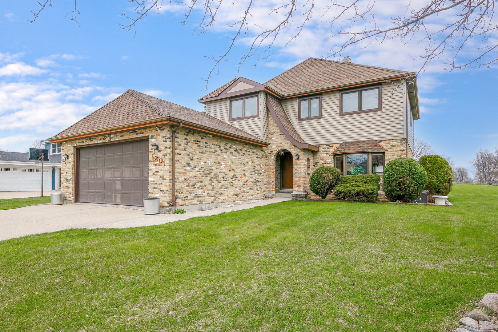 1201 Honey Hill Road Addison, IL 60101 - Photo 1 of 4 a front view of a house with a yard and garage
