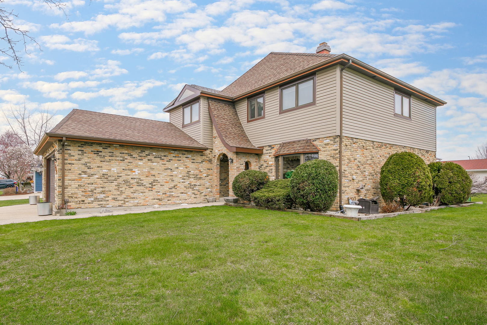 1201 Honey Hill Road Addison, IL 60101 - Photo 2 of 4 a front view of a house with a yard