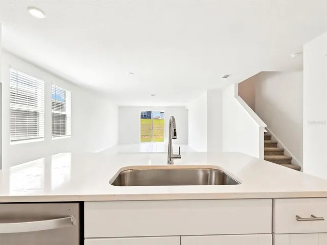 a kitchen with a sink and a window