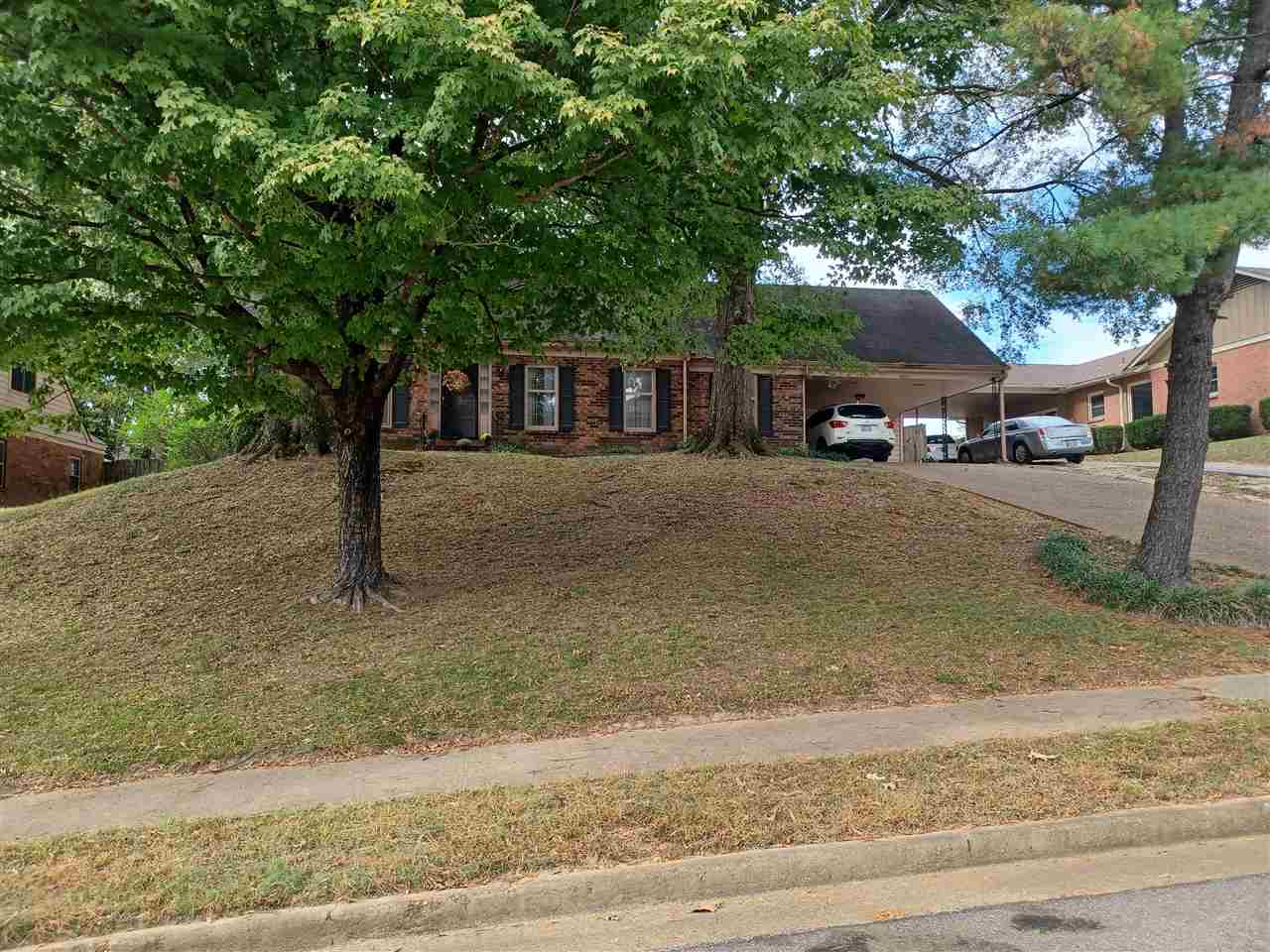 3255 Scotland Road Memphis, TN 38128 - Photo 1 of 1 a front view of a house with garden