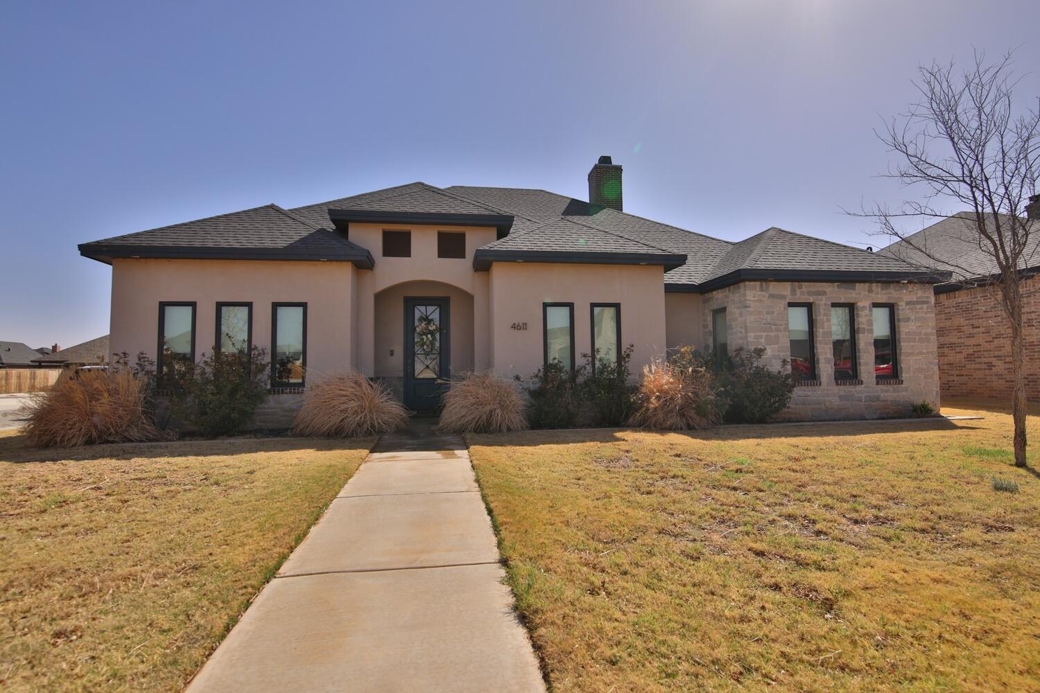 4611 139th Street Lubbock, TX 79424 - Photo 1 of 38 a front view of a house with yard