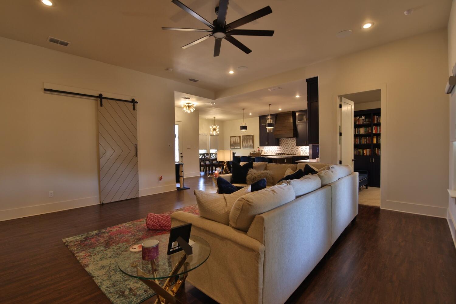 4611 139th Street Lubbock, TX 79424 - Photo 19 of 38 a living room with furniture and a wooden floor