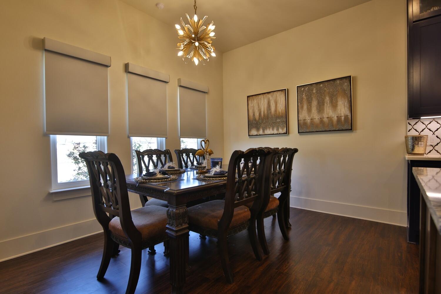 4611 139th Street Lubbock, TX 79424 - Photo 2 of 38 a view of a dining room with furniture and wooden floor