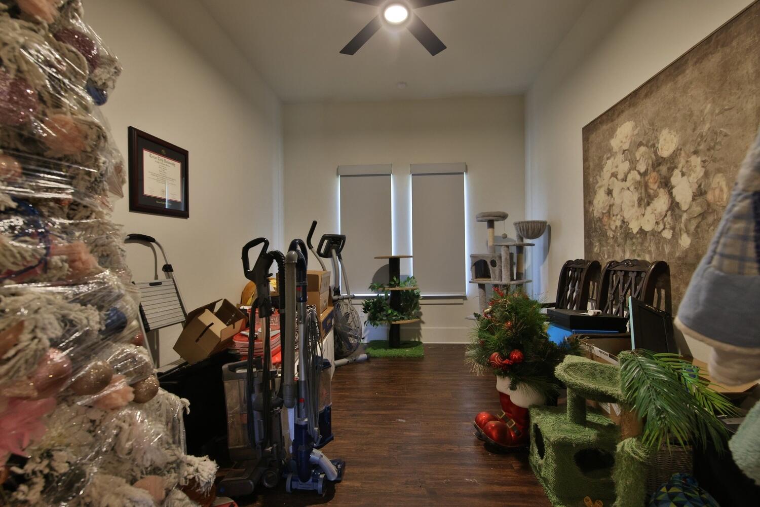 4611 139th Street Lubbock, TX 79424 - Photo 21 of 38 a view of a room with gym equipment