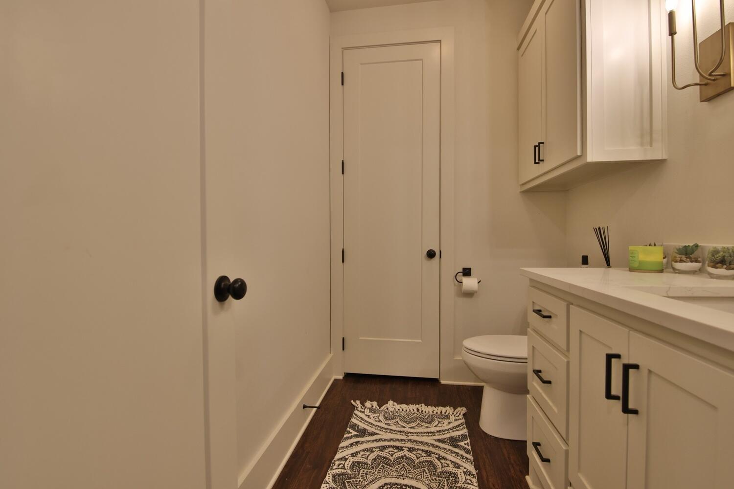 4611 139th Street Lubbock, TX 79424 - Photo 24 of 38 a bathroom with a granite countertop sink toilet and shower