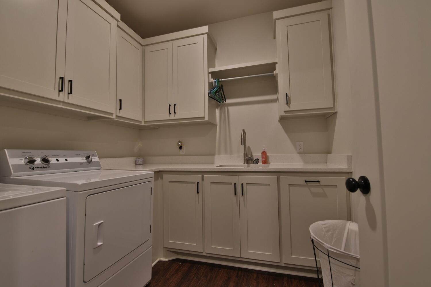 4611 139th Street Lubbock, TX 79424 - Photo 26 of 38 a kitchen with a sink a stove and cabinets