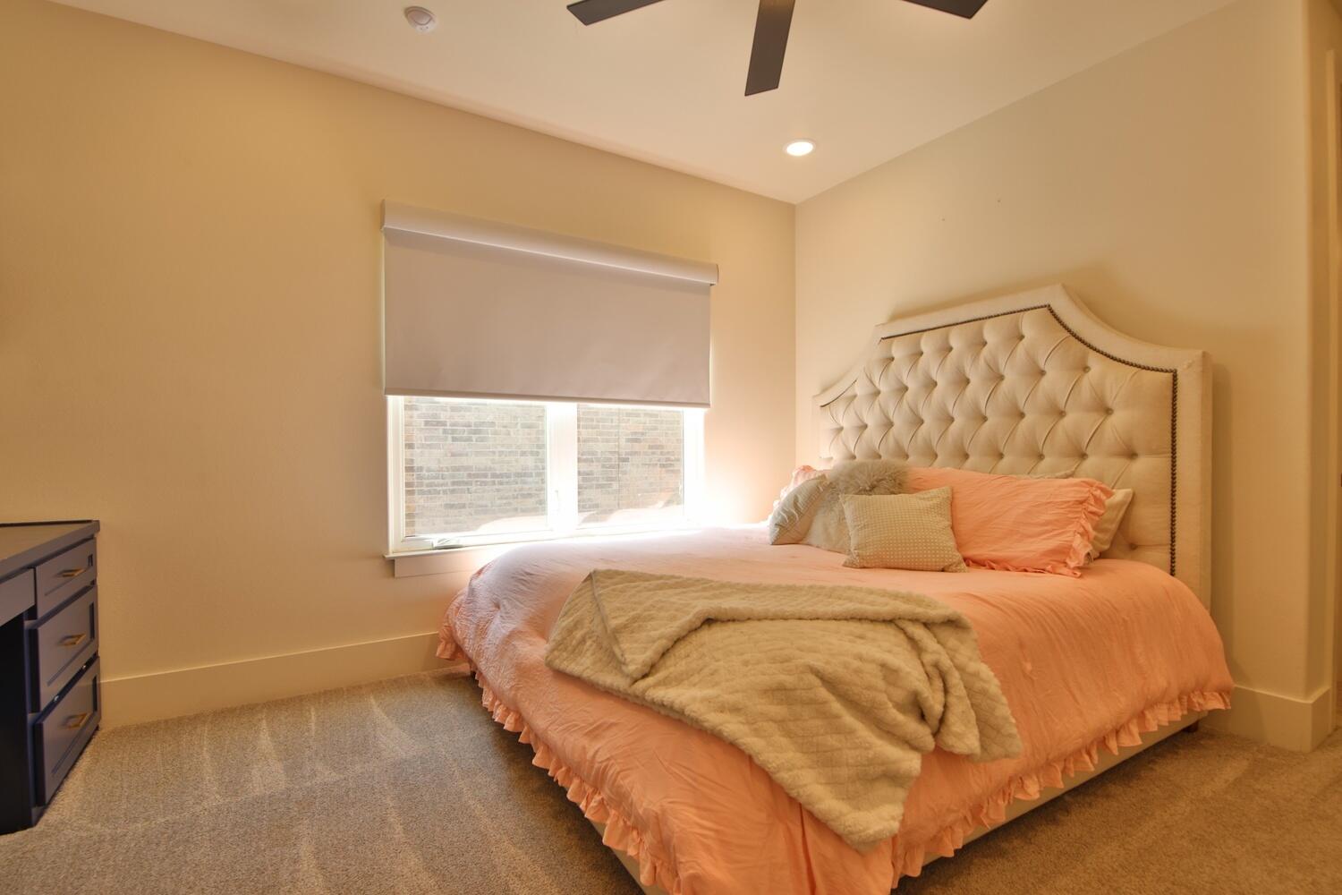 4611 139th Street Lubbock, TX 79424 - Photo 33 of 38 a bedroom with a bed and a window