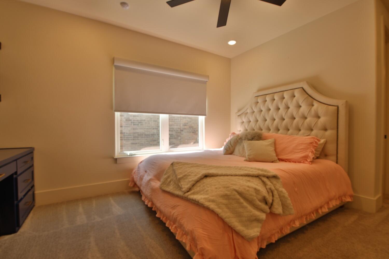 4611 139th Street Lubbock, TX 79424 - Photo 34 of 38 a bedroom with a bed and a window