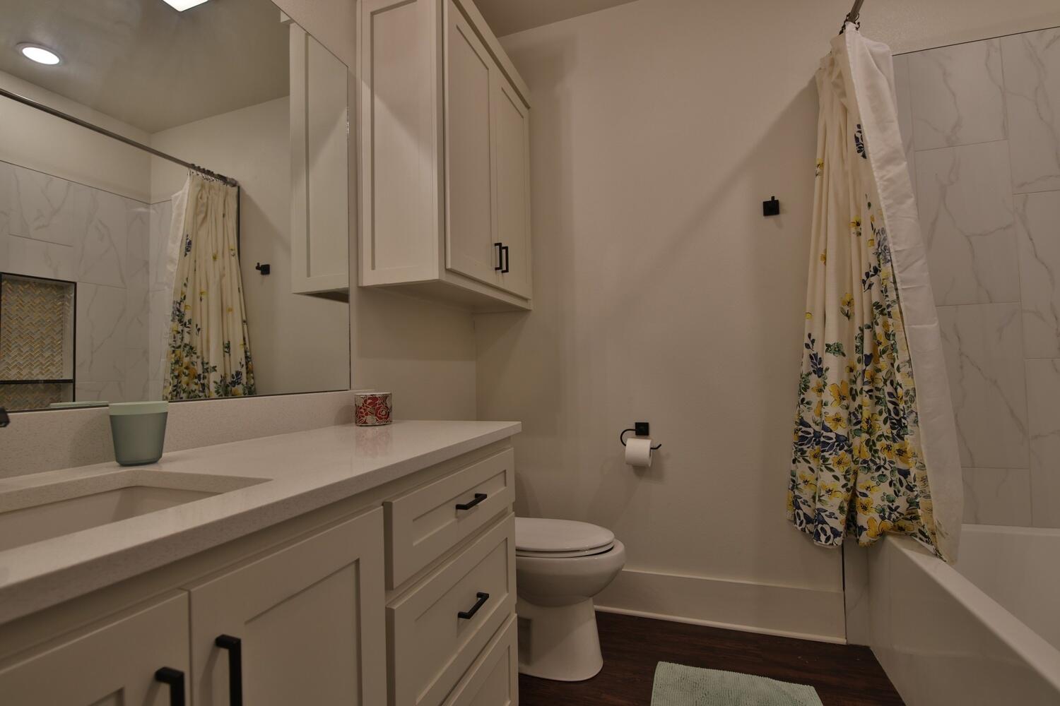 4611 139th Street Lubbock, TX 79424 - Photo 36 of 38 a bathroom with a sink toilet and shower
