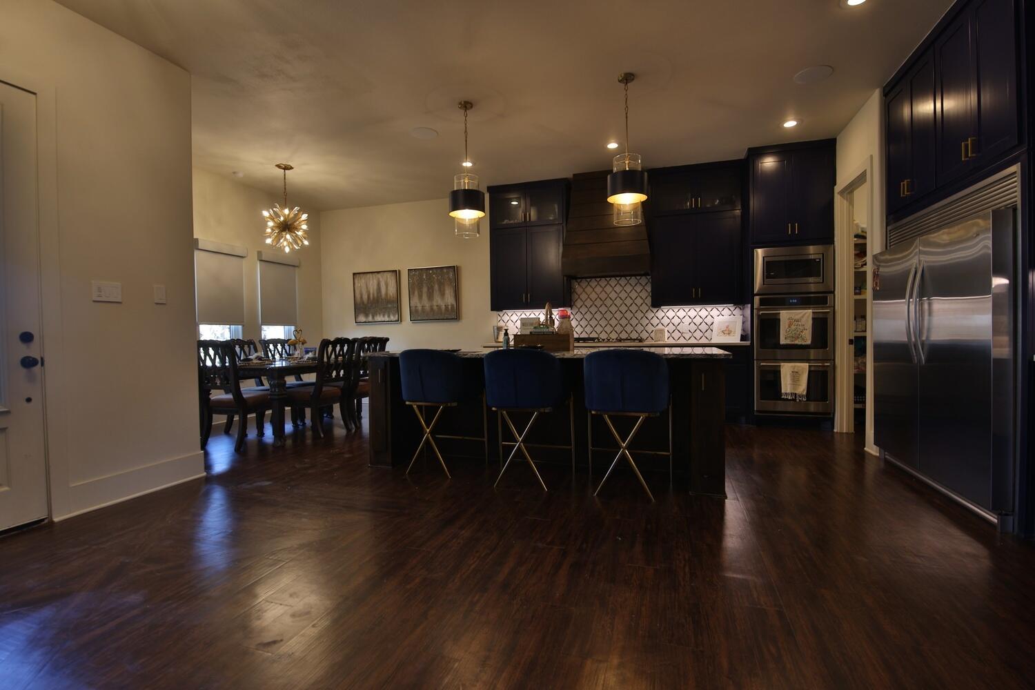 4611 139th Street Lubbock, TX 79424 - Photo 38 of 38 a view of a dining room with furniture and wooden floor
