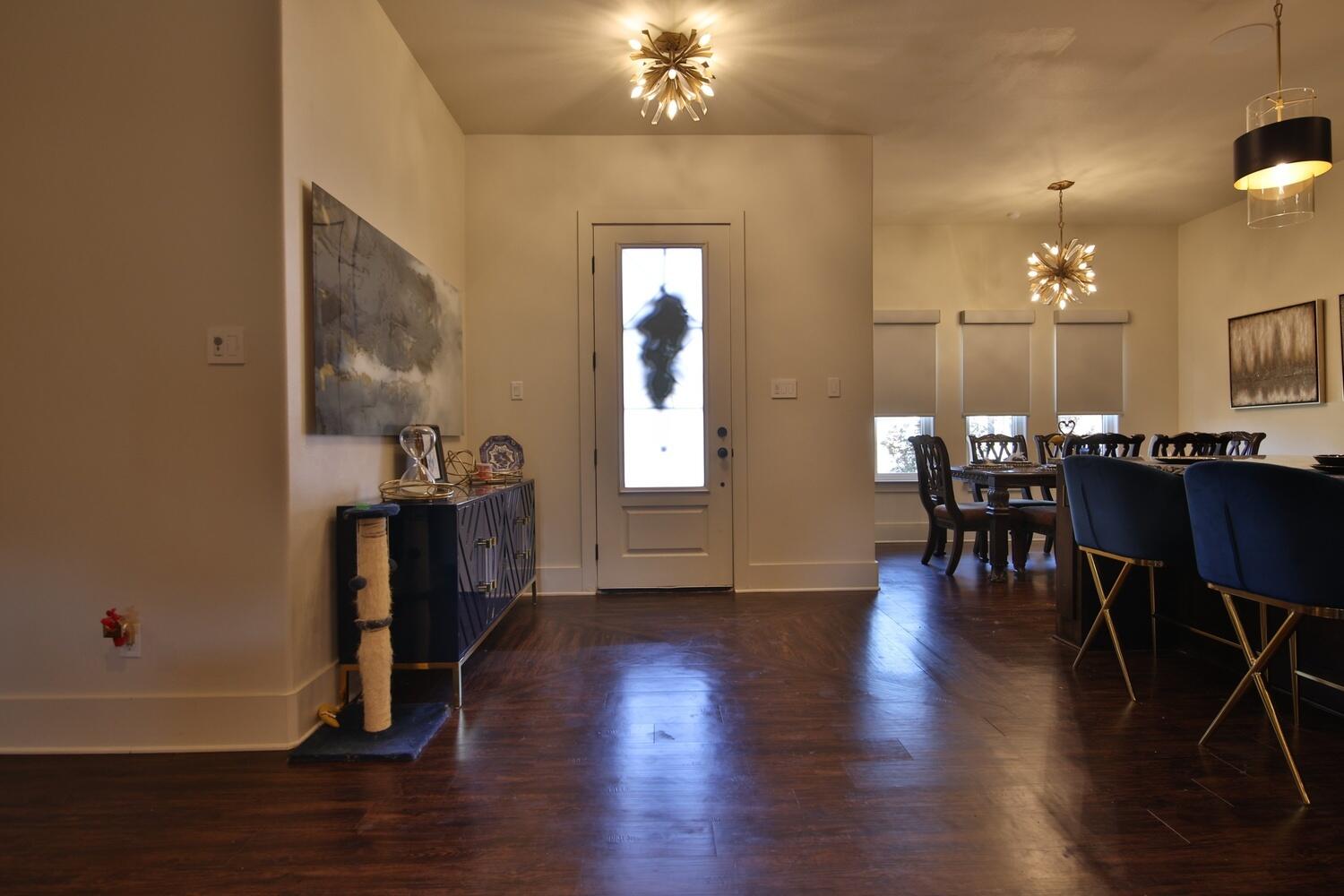 4611 139th Street Lubbock, TX 79424 - Photo 4 of 38 a view of a dining room with furniture and wooden floor