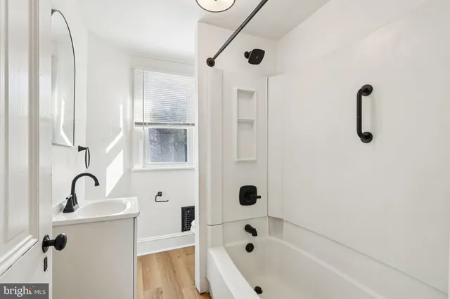 a bathroom with a sink and mirror