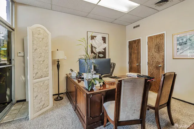 a workspace with furniture and window