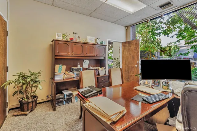 a view of a workspace with furniture