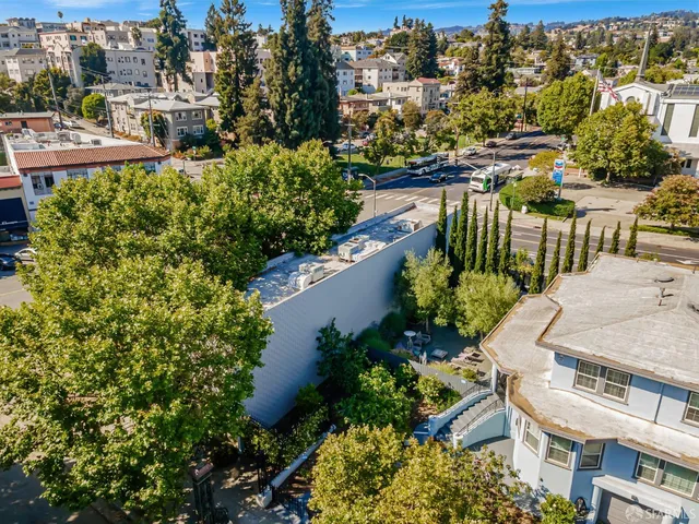 an aerial view of residential house with outdoor space and swimming pool