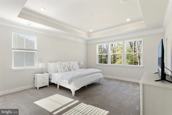 a room with a bed and a window