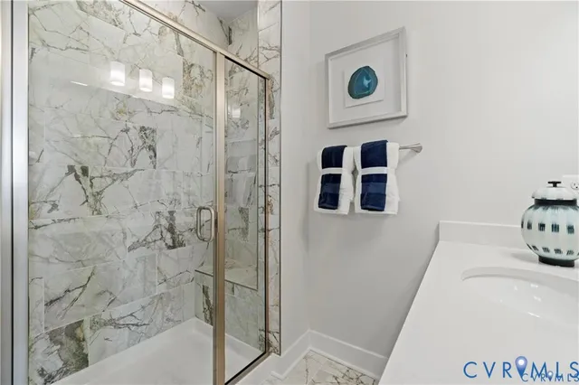 a bathroom with a tub and shower