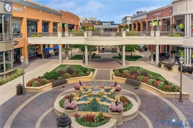 a front view of a building with outdoor seating