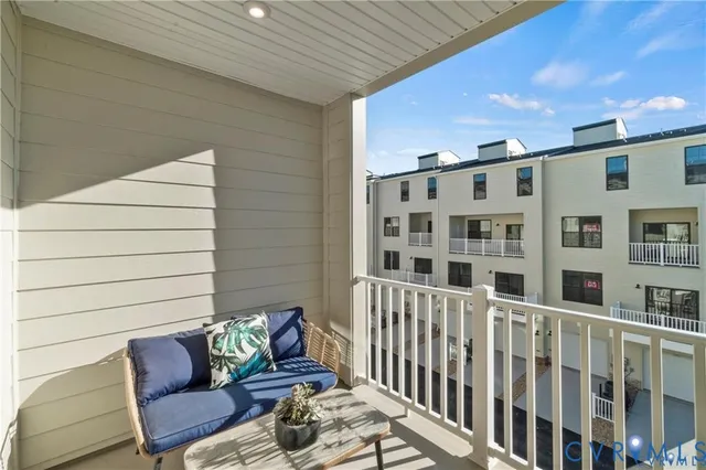 a view of a balcony with furniture