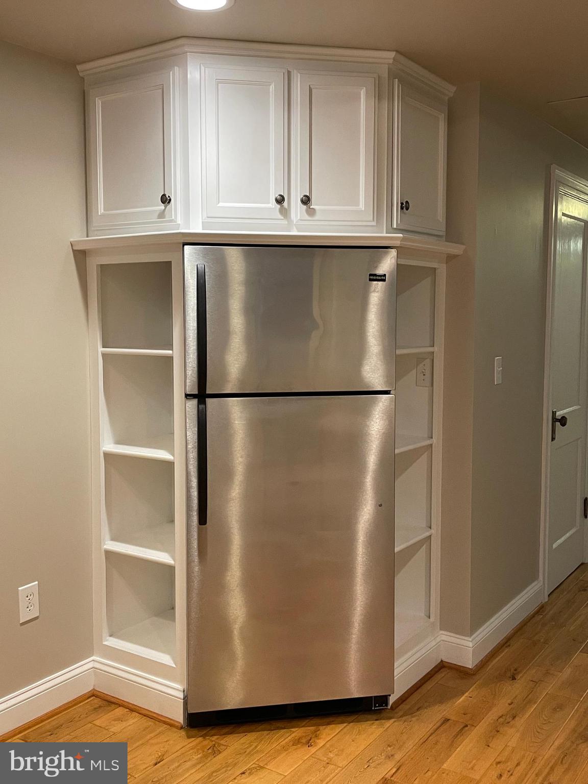 2442 20th Street Northwest, Unit B Washington, DC 20009 - Photo 16 of 19 a view of cabinets and wooden floor