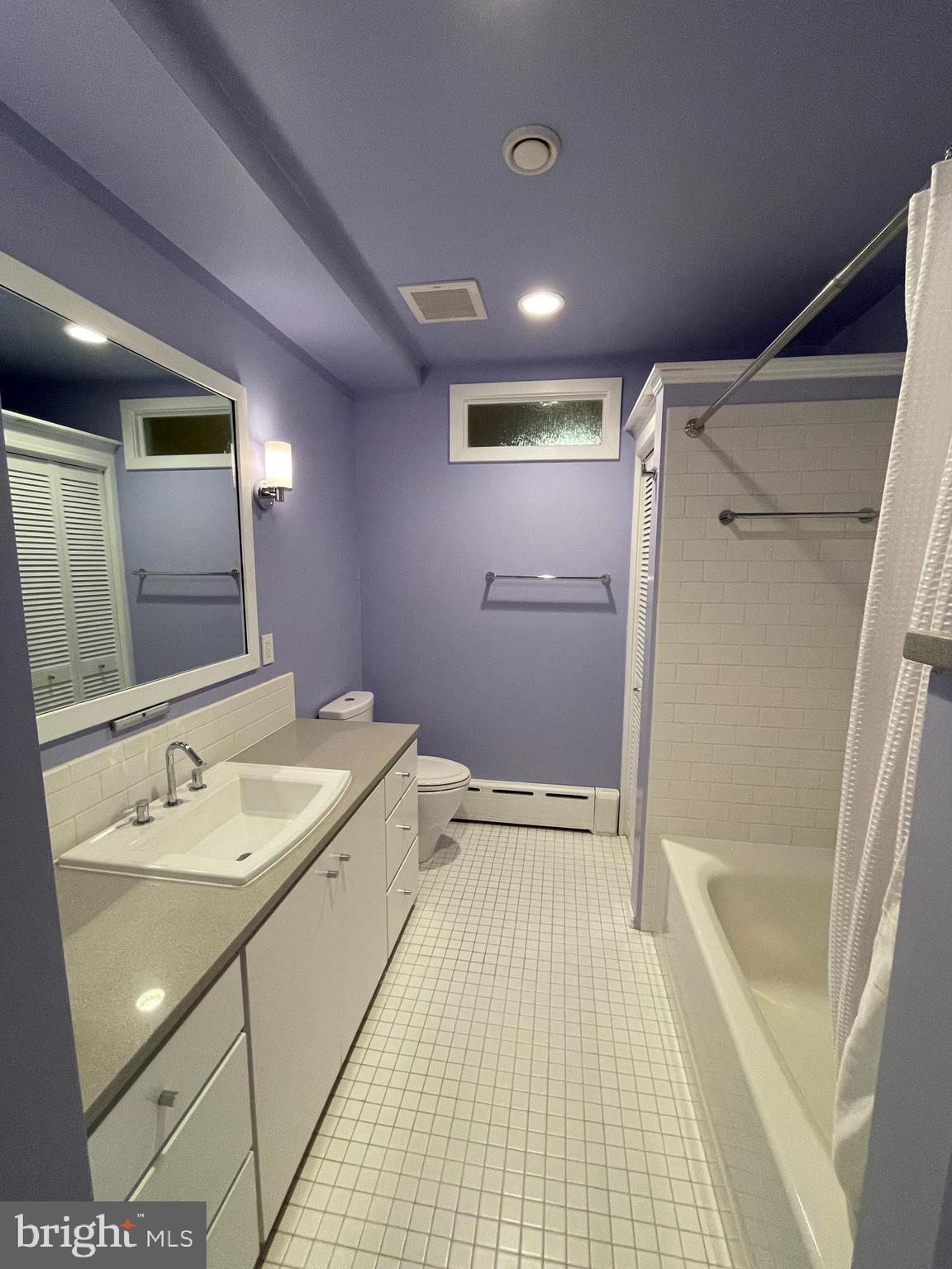 2442 20th Street Northwest, Unit B Washington, DC 20009 - Photo 7 of 19 a bathroom with a sink and a mirror