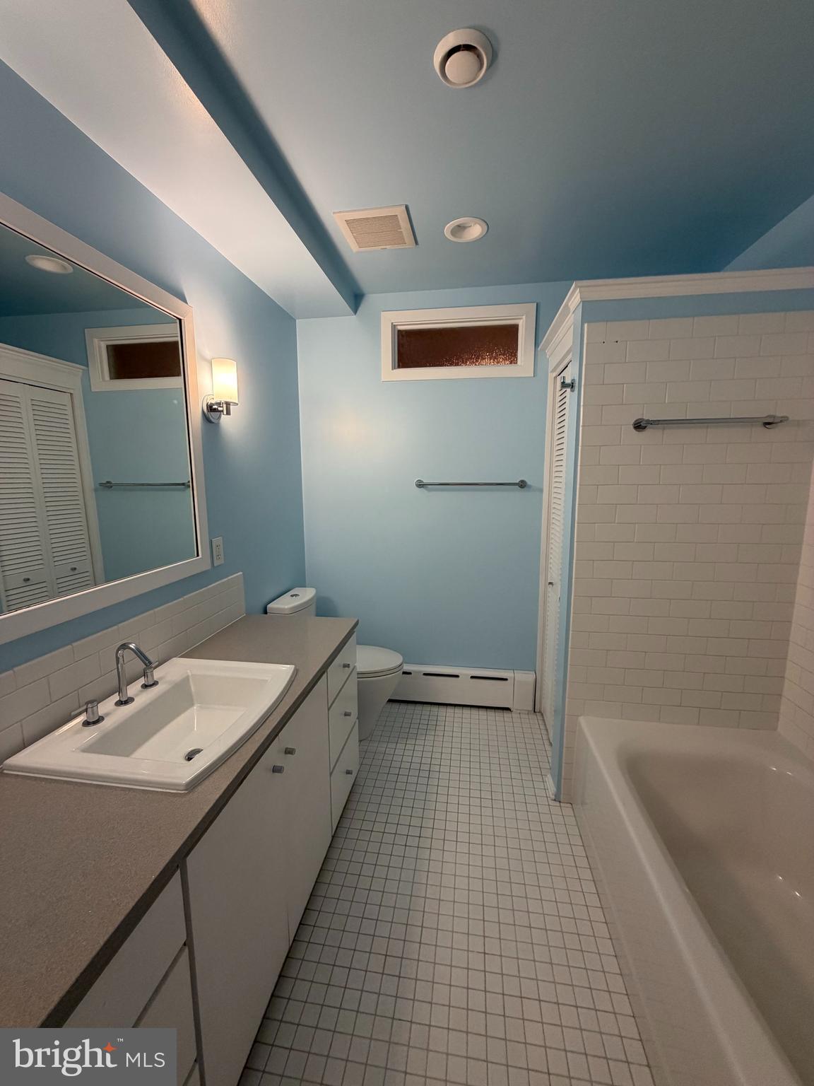 2442 20th Street Northwest, Unit B Washington, DC 20009 - Photo 7 of 15 a bathroom with a granite countertop sink a toilet and shower