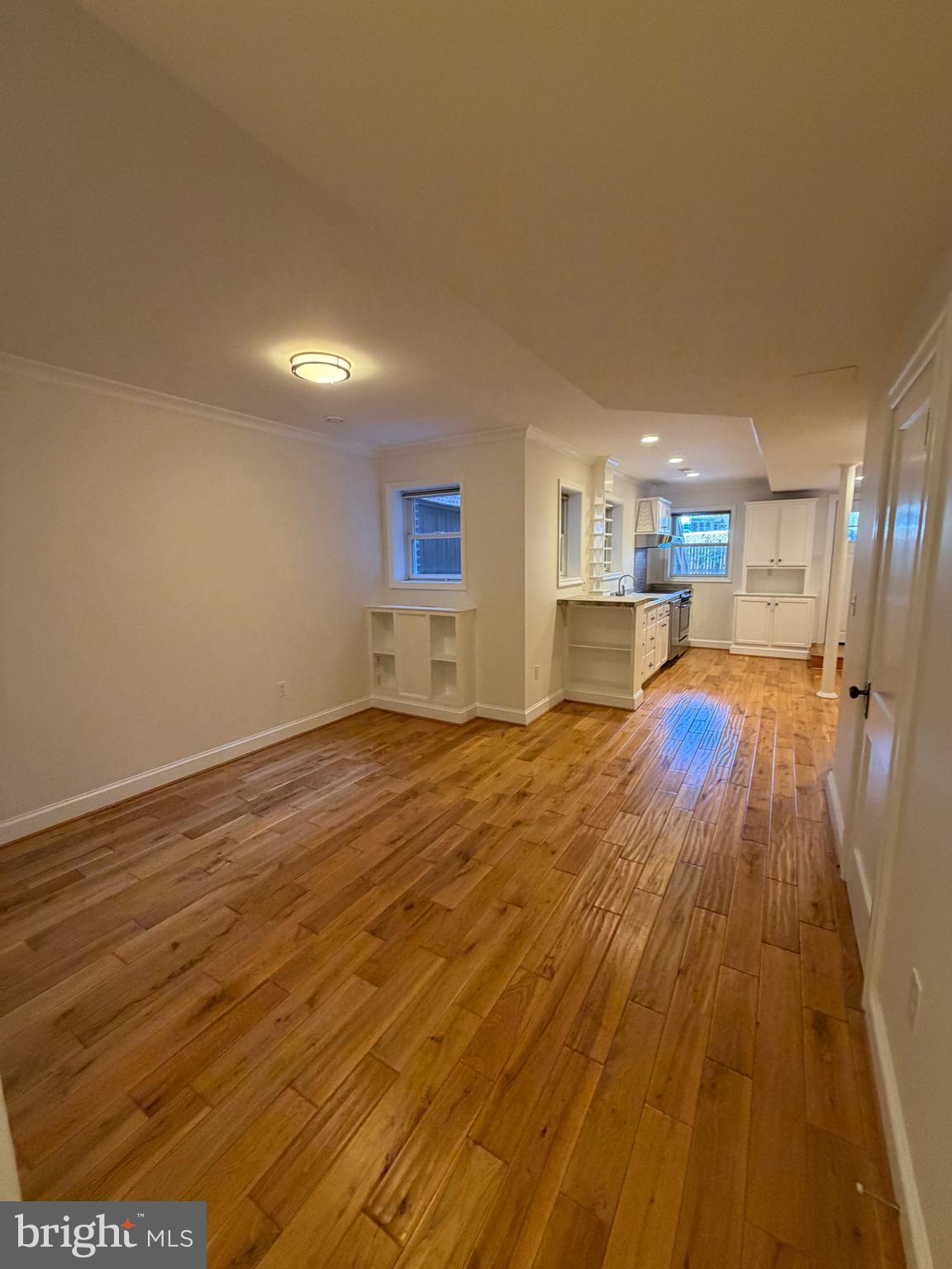 2442 20th Street Northwest, Unit B Washington, DC 20009 - Photo 9 of 15 a big room with wooden floor and a kitchen view