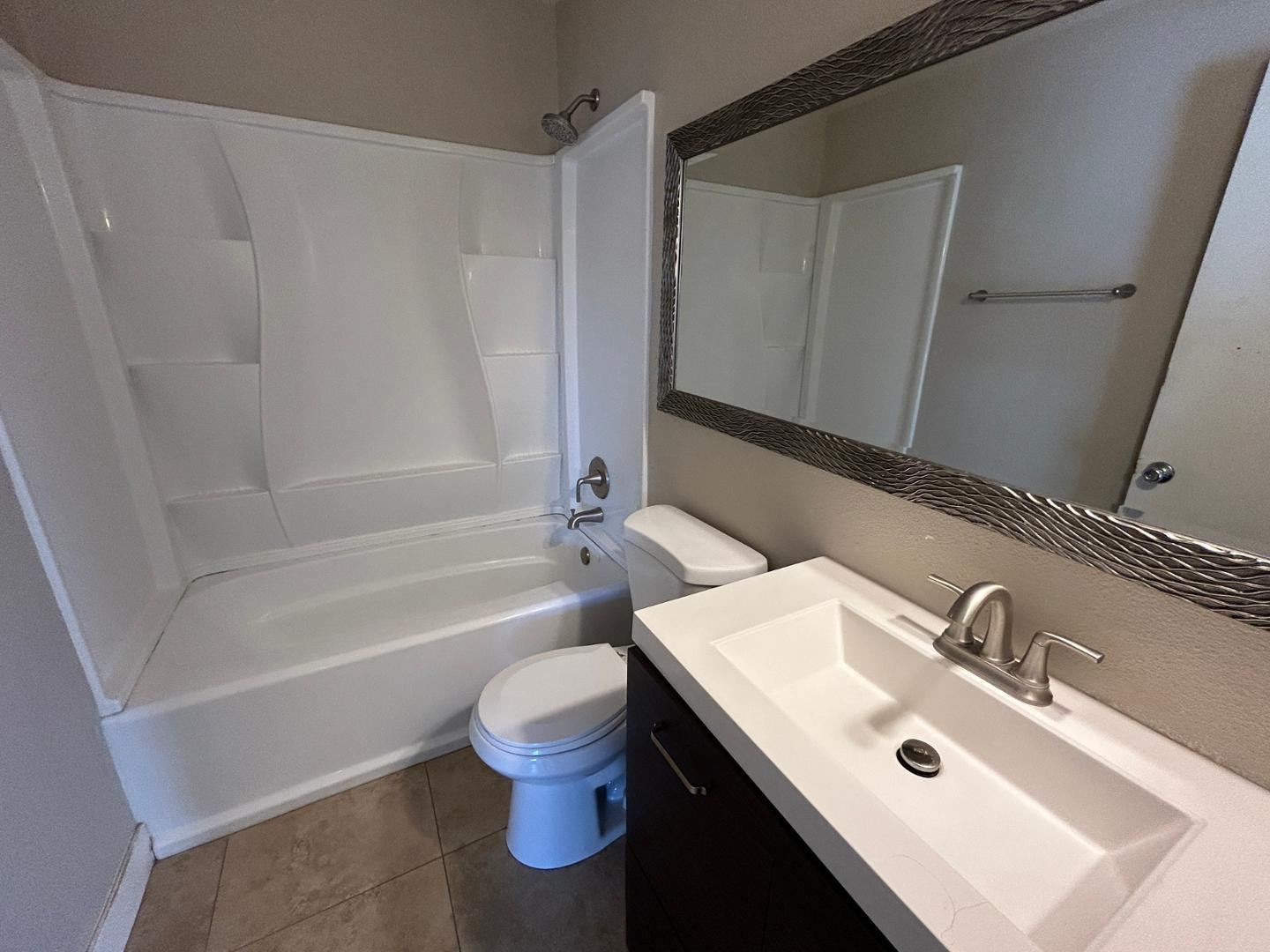 859 South Ext Road Mesa, AZ 85210 - Photo 18 of 19 a bathroom with a sink toilet and shower