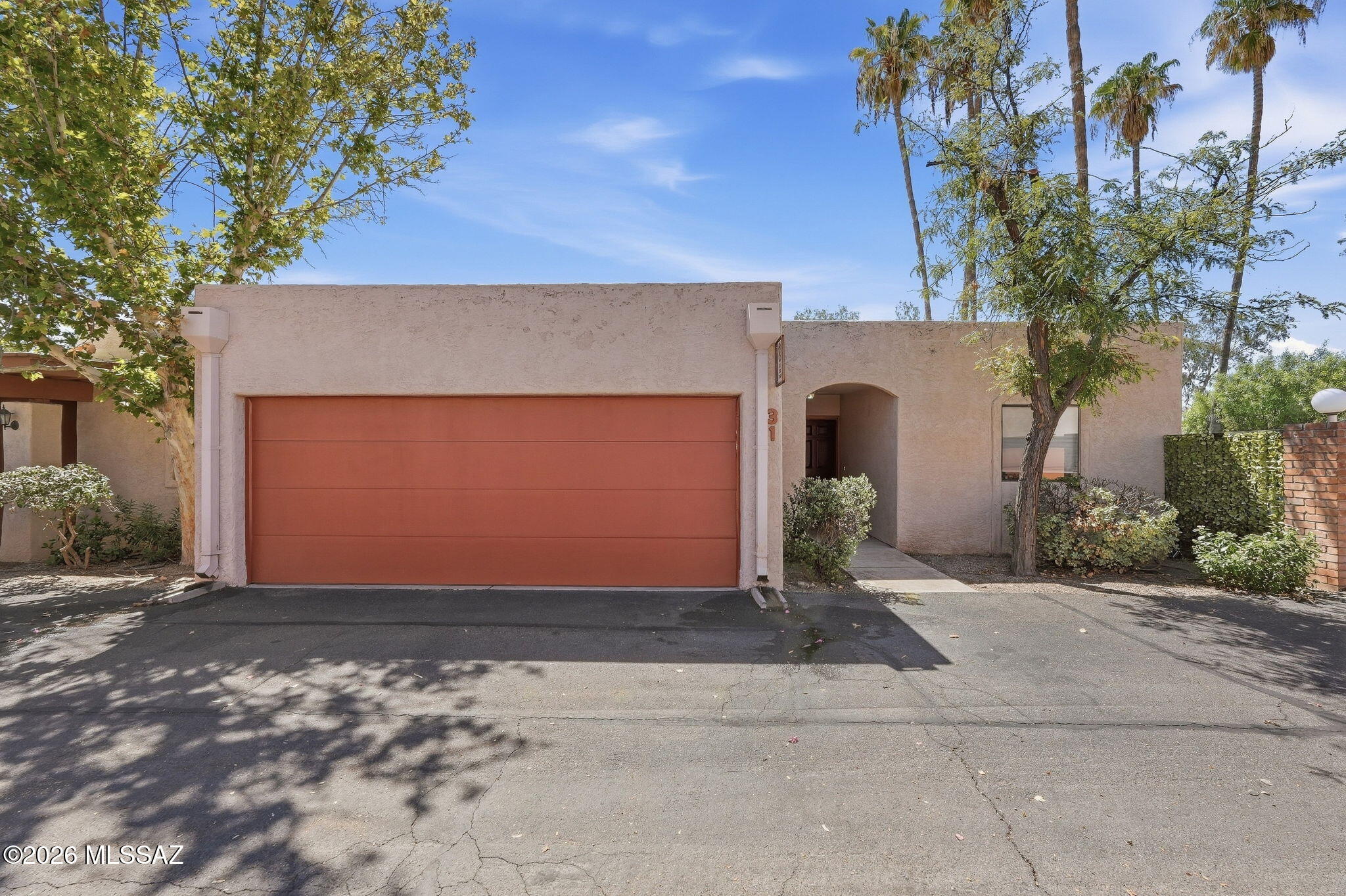1949 North Swan Road, Unit 31 Tucson, AZ 85712 - Photo 3 of 33 Garage door and trim recently renovated and painted
