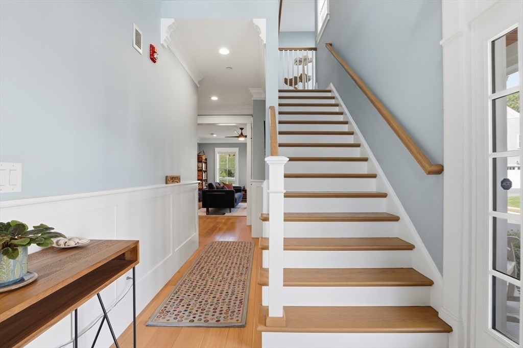 47 Cutter Lane, Unit 47 Amesbury, MA 01913 - Photo 13 of 33 a view of entryway and hall with wooden floor