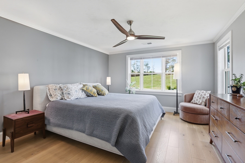 47 Cutter Lane, Unit 47 Amesbury, MA 01913 - Photo 14 of 33 a bedroom with a bed couch and window